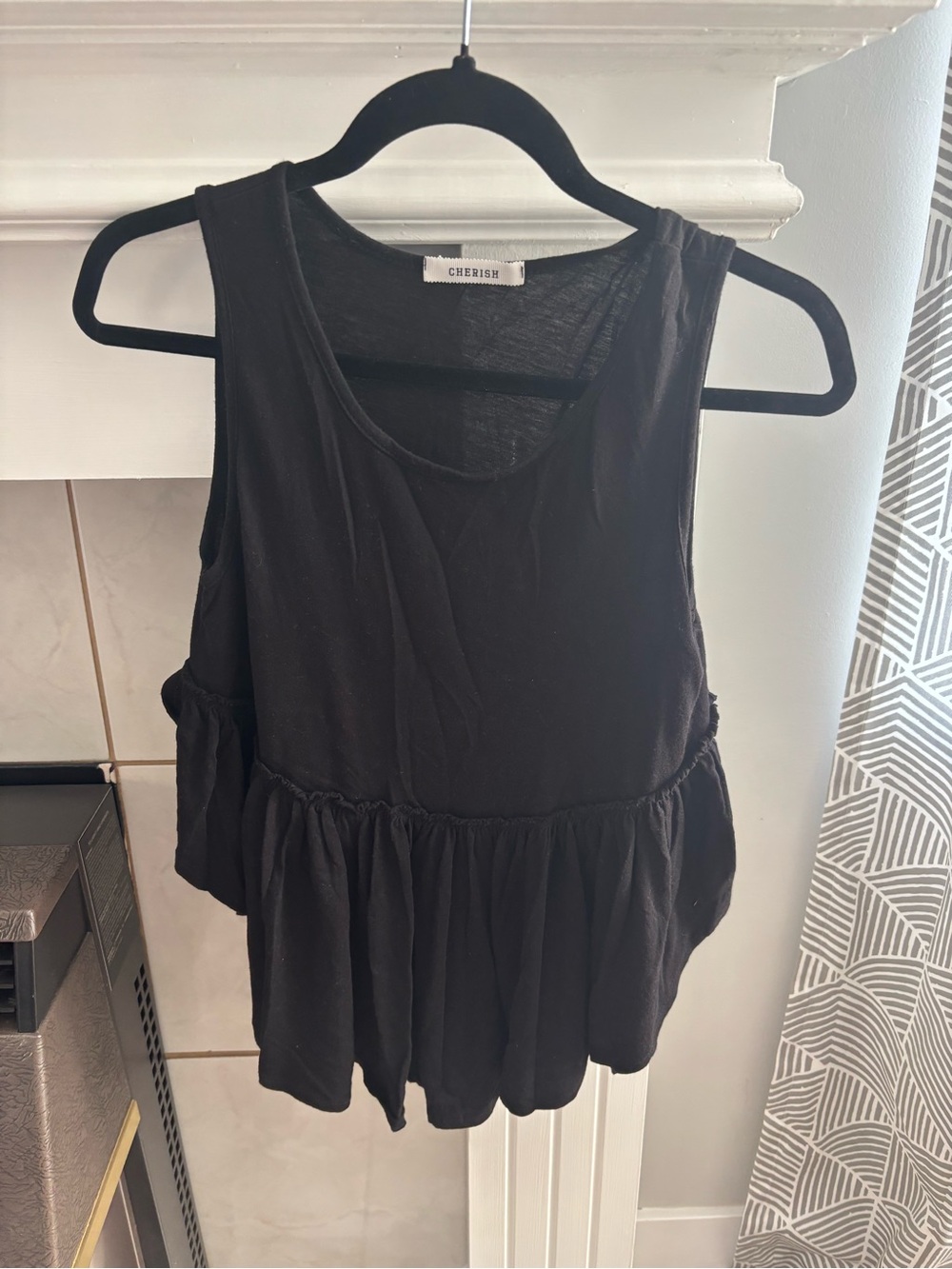 Cherish Black Sleeveless Peplum Tank